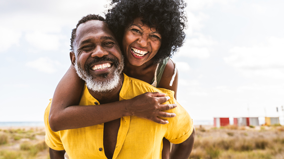 retired couple smiling outdoors