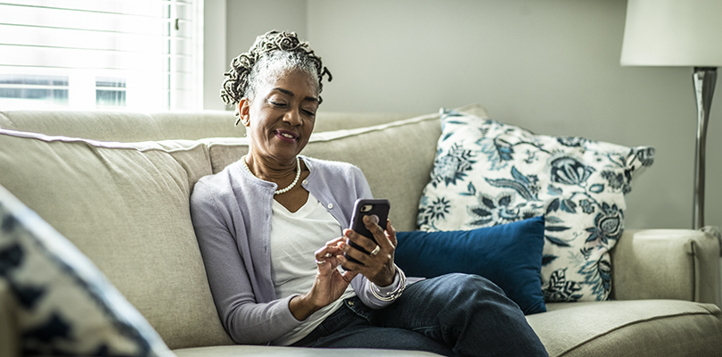 CalPERS member using her phone to her preferences in myCalPERs