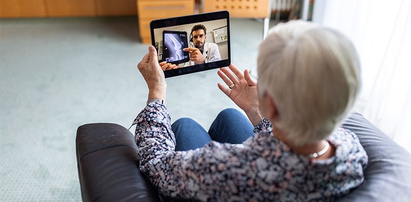Senior using tablet for doctor's appointment