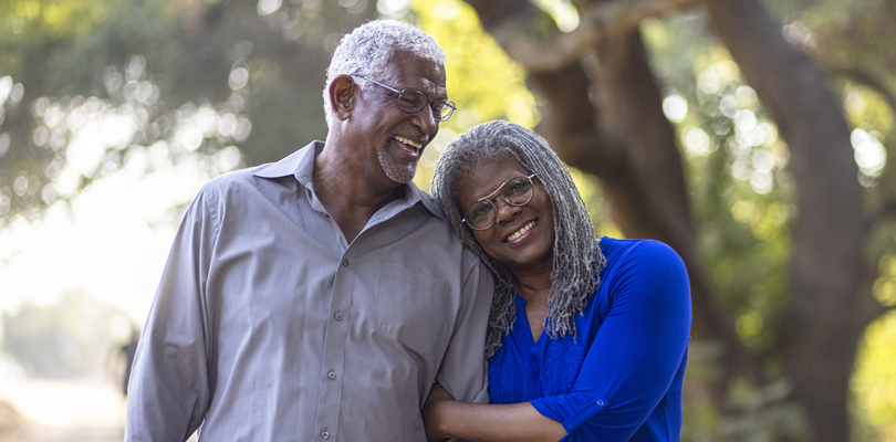 Older Black man and woman smiling