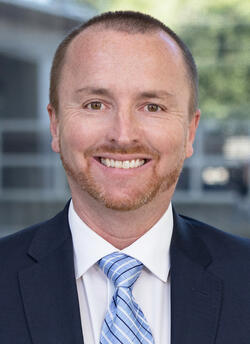 Headshot of Global Fixed Income Managing Investment Director Justin Scripps